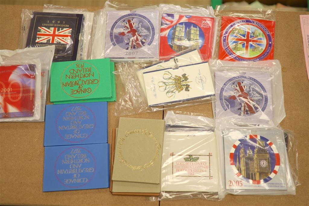 A collection of 45 UK brilliant uncirculated coin year sets, some duplicates and 2 HRH Prince of Wales UNC £5